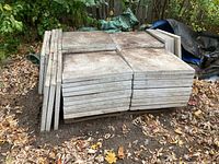 Stack of concrete patio blocks arranged outdoors