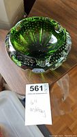 Top view of vintage green bubbly glass ashtray showing bubble pattern and ashtray indentations