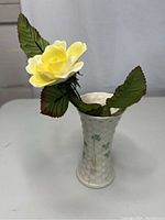 Full view of the Belleek vase with handcrafted Royal Stratford yellow rose inside