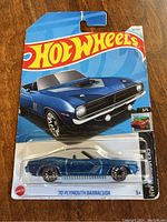 Front of Hot Wheels packaging showing blue '70 Plymouth Barracuda car in blister pack with Hot Wheels logo and branding.