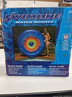 Front view of the Swimline Tie-Dye Island inflatable lounger box showing product image and features.