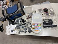 Overview of the rotary tool system spread on a table including the main tool, stands, flexible extensions, accessory kits, and carry bag