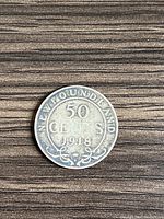 Reverse side of the 1918 Newfoundland silver 50 cent coin featuring the denomination and date surrounded by decorative elements.
