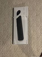 Photo of Microsoft keyboard and mouse set box, showing product image and Microsoft branding on box.