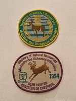 Front side of two like new Ministry of Natural Resources deer hunter patches from Ontario, 1991 and 1994 editions.