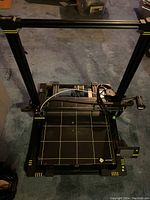 Front view of assembled Anycubic Chiron printer showing frame, build plate, and extruder assembly