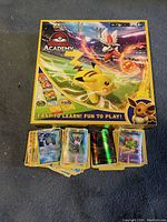 Top view of Pokémon Battle Academy box with some cards spread in front