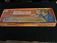 Closed original game box with colorful image of children playing alongside branding and game name.