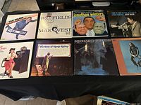 Overview of 8 comedy LP records with various comedians including Dave Simons, W.C. Fields, Mae West, Jonathan Winters, Richard Pryor, and others.