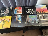 View of 8 LP record covers including Jim Dale Barnum, Gabriela, Forbidden Broadway, and Green Hornet showing variety of soundtrack albums
