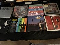 Wide view of 9 jazz LP records arranged in three rows showing diverse album art and titles for the lot.