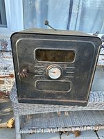 Front view of the Milcor double wall warming oven showing the door with window, temperature gauge and handle.