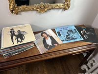 Wide view of the vinyl stack and three distinct album covers