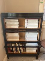 Front view of three-tier barrister bookcase with closed glass-fronted shelves