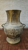 Front view of 9-inch bronze replica vase showing detailed Shang Dynasty style motifs and flared neck