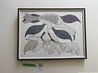 Full view of framed print showing three polar bears and stylized bird