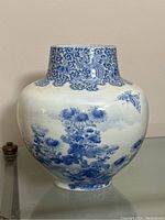 Front view of vase showing floral and bird motif