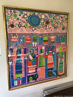 Full front view of the framed artwork hung on wall