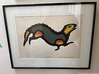 Full frontal view of framed silkscreen print showing otter image, mat and frame.