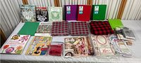 Full spread of crafting books, fabric pieces, folders and crafting supplies.