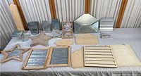 Overview photo showing all metal and wood decor items arranged on table with varying sizes and shapes including stars, rectangle plaques, buckets, and signs.