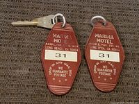 Two vintage red plastic motel keychains each with metal keys, labeled 31, from Marina Motel Long Beach CA