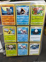 Page showing Rockruff, Snorunt, Gloom, Sunkern, Seel, Panic Mask, Rowlet, second Seel, and Like Aucity cards.
