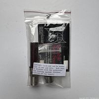 Photo of the reel seat sealed in plastic bag along with instruction sheet.