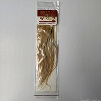 Original sealed packaging showing the entire feather pack and package details.