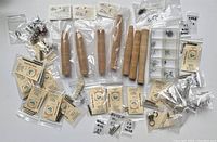 Overview photo of all included cork rod handles, guides, ferrules, screws, and other rod building components displayed on a surface.