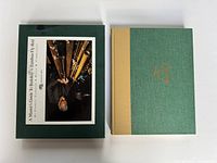 Book and sleeve showing title and cover condition.