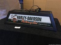 Front view of the rectangular Harley Davidson pool table hanging lamp with wooden frame and logo design.