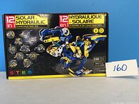 Front image showing kit box labeled '12-in-1 Solar Hydraulic Construction Kit' with dinosaur model and number of pieces (230)