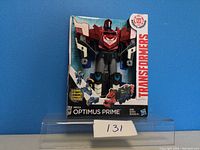 Front view of sealed Transformers Mega Optimus Prime figure box showing figure and branding.