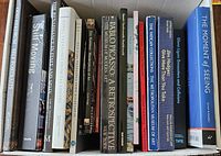 Box containing a group of art books showing titles such as Pablo Picasso A Retrospective, The Vatican Collections, and Jim Hodges