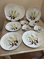 Full set of 9 pieces displayed on table, showing dinner plates, fruit bowls, and large platter with matching hand-painted design.