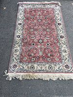 Full view of the vintage wool area rug showing the overall pattern, colors, and dimensions.