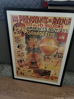Full view of the framed vintage Paris travel poster featuring colorful illustrations and text.