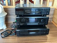 Front side view of cassette deck TC-WE405, receiver STR-DE405, and CD player CDP-CE305 stacked horizontally showing control buttons, knobs, and cassette bays.