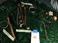 Overview of entire lot laid out on green cloth