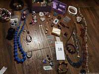 Overall view of assorted jewelry on wooden surface