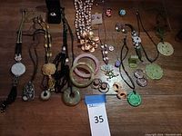 Overview of all jewelry pieces on wooden surface