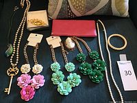 Wide shot of all items laid out on dark fabric background.