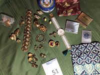 Overview of entire lot on green fabric