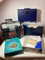 Overview of all three file organizers and two boxes of file folders on table surface