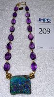 Full-length view of necklace showing amethyst beads, opal pendant, gold accents and safety clasp on white background with lot tag.