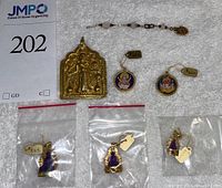 Overall group view of seven items on white cloth