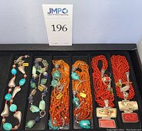 All six necklaces displayed in tray