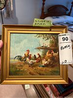 Framed oil painting showing group of roosters and hens with dimension label and MaxSold sticker