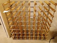 Overview of wine rack showing multiple wooden slats and metal frame with capacity for 56 bottles.